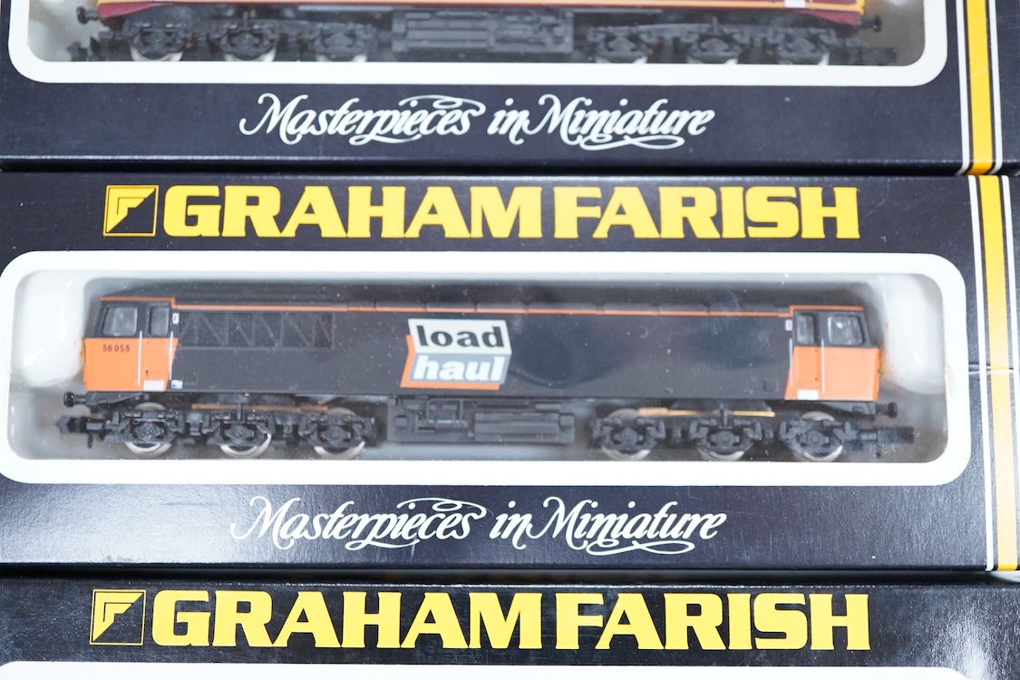 Four boxed Graham Farish N gauge railway class 56 diesel locomotives; a Load Haul, 56055, (805D), an EWS, British Fuels 56057 (805E), a Coal Sector, 56 092, (8057) and a Construction Sector, 56 059 (8056).